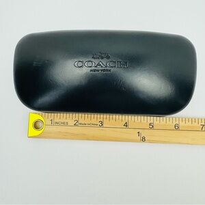 Coach New York black hard shell clamshell sunglasses case. Lens cleaner included